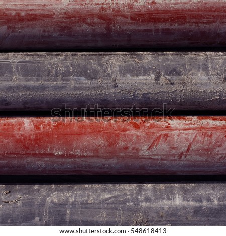 Seamless textures of colored rolls placed vertical. pipe as a background