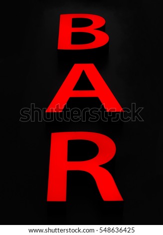 Red signboard Bar on a black background