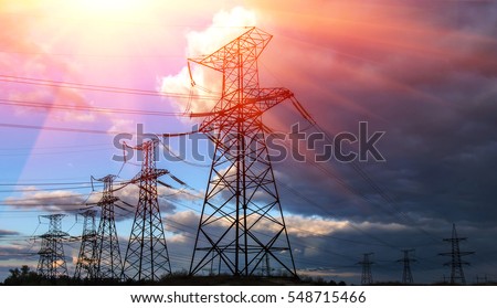  high-voltage  power lines at sunset. electricity distribution station. high voltage electric transmission tower.  Royalty-Free Stock Photo #548715466