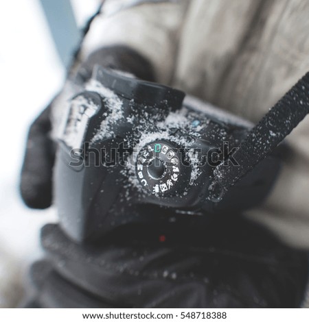Camera in snow. Mode Dial. 