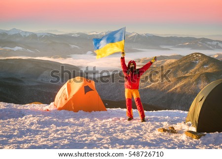 At the highest peak of Ukraine Goverla stands on New Year camp climbers romantic Ukrainian country. Extreme tent buried in snow storms withstand bad weather and frost wind Chernogora
