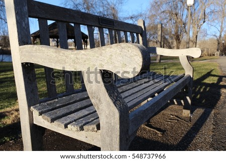 Bench with discolored wood in park