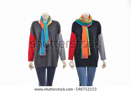 Two mannequin in female clothes with jeans and scarf  â??white background