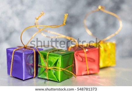 Gift Box And Baubles On Snow With Shiny Background bokeh