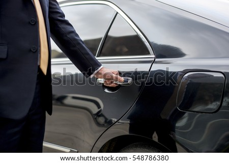 Businessman Handle Limousine Door Car Royalty-Free Stock Photo #548786380