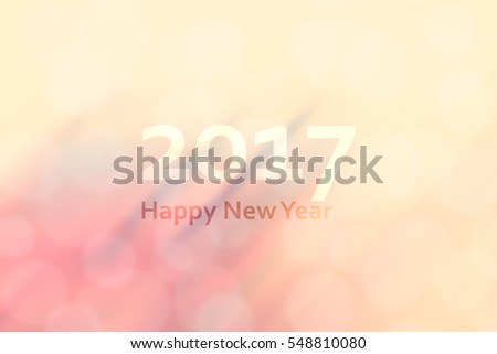 Happy new year 2017. Abstract background with motion blur and bokeh. retro, vintage and warm color tone.