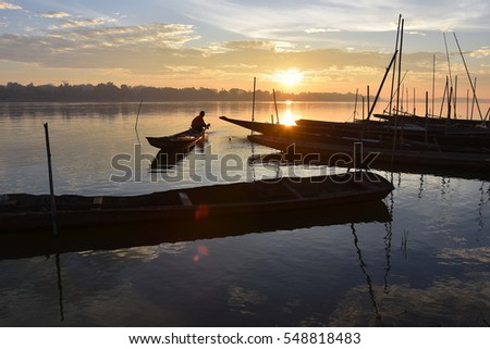 Mekong early morning,villager prepare boat to fishing , Nakhon Phanom Thailand , Border Thailand and Lao Royalty-Free Stock Photo #548818483