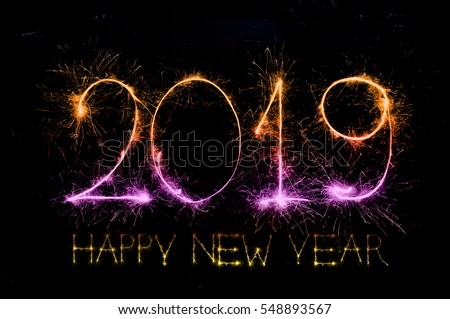 HAPPY NEW YEAR 2019 from colorful sparkle on black background  