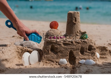 Sand castle on the beach Royalty-Free Stock Photo #548920678