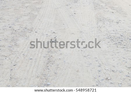 Closeup surface street floor in the countryside with tire tracks textured background