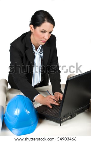 Constructor engineer or architect woman in a office working on projects and typing at laptop isolated on white background