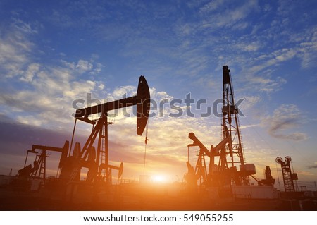 Oil Pump on orange sunset