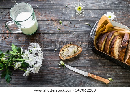 Baked bread on wooden background