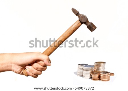 Raise the Hammer to smash coin stack isolated on white background, Business and finance 