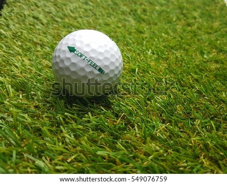 Closeup of golf ball with selective focus.