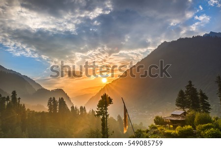 Sunset at Himalayan foothills Royalty-Free Stock Photo #549085759