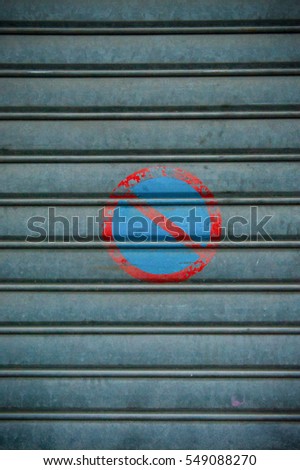 no parking traffic sign on a metal sheet garage door