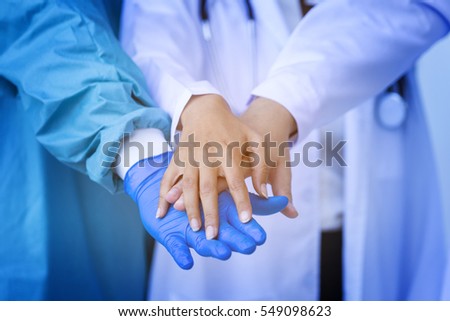 Group of doctor worker touching hands together, agree on partner, partnership of medical healthcare for patients. And delivery good of service and satisfaction for mission complete. Teamwork concept
 Royalty-Free Stock Photo #549098623
