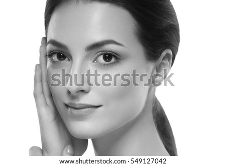 Beauty Woman face Portrait. Beautiful model Girl with Perfect Fresh Clean Skin. Blonde brunette short hair Youth and Skin Care Concept. Isolated on a white black and white