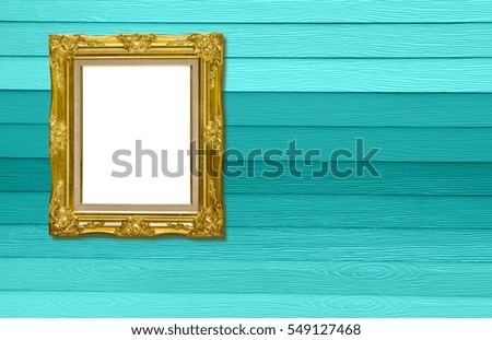 antique golden picture frame on wood texture