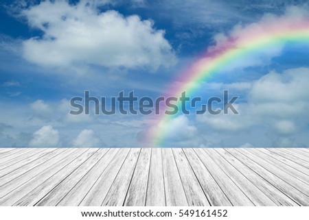 Nature cloudscape with blue sky and white cloud with Wood terrace and rainbow