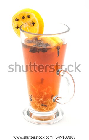 hot citrus drink with alcohol and orange slices and spices, winter drink, product photography for restaurant or cafe