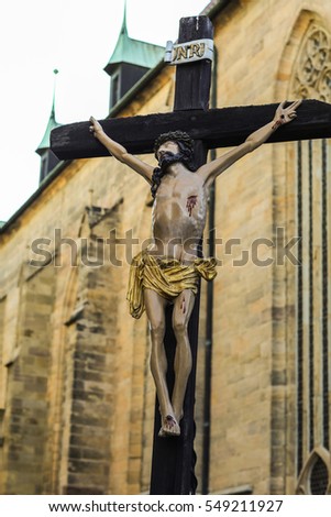 Jesus Christ on the cross with fall trees in the background germany