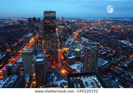 A Rising moon over the city of Boston