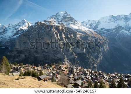 A photograph of the mountain known as MÃ¶nch in the Bernese Alps, Switzerland. It was taken on an unusually sunny and warm winters day in late December. 