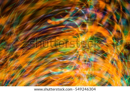 an image of bright sparks on colorful background with bokeh effect