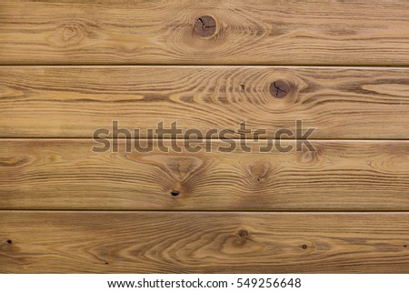 Natural wooden brown background, rough texture of hardwood planks for floors and walls in the construction of the house Royalty-Free Stock Photo #549256648