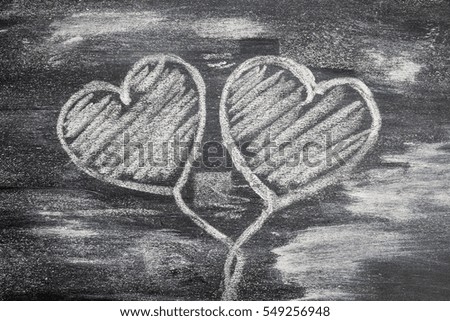 Chalk love heart symbol on a blackboard