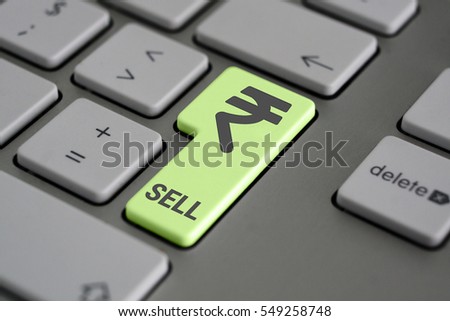 Closeup of computer keyboard with rupee button