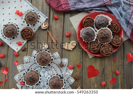 Chocolate cupcakes on the day of lovers and various ornaments in the shape of heart