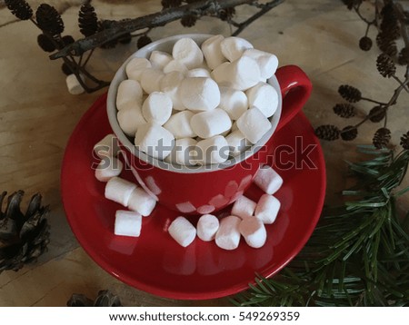 Morning coffee in a red cup with marshmallows. Happy Valentine`s day. Love day. Sweet morning coffee