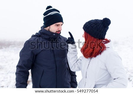 Picture of a young couple having a fight durring vacation