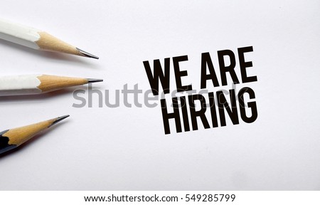 We are hiring text memo written on a white background with pencils