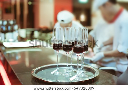 sweet wine in wine glass on bar for service in luxury dinner party, Blurry background with vintage color style.