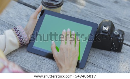 Woman relaxing reading on the tablet computer