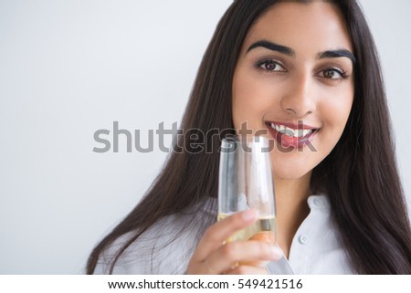 Closeup of Smiling Indian Lady with Glass of Wine