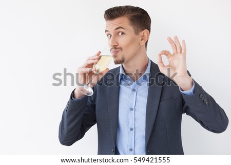Business Man Drinking Wine and Showing OK Sign