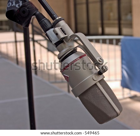 Microphone mounted on a boom stand on a outdoor stage at Lincoln Center in New York City.