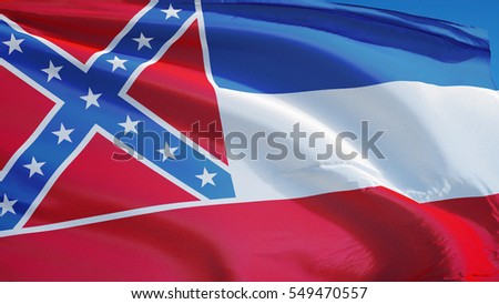 Mississippi (U.S. state) flag waving against clear blue sky, close up, isolated with clipping path mask alpha channel transparency, perfect for film, news, composition