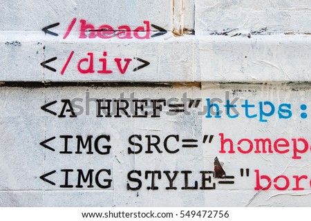 Stencil of HTML code on white wall 