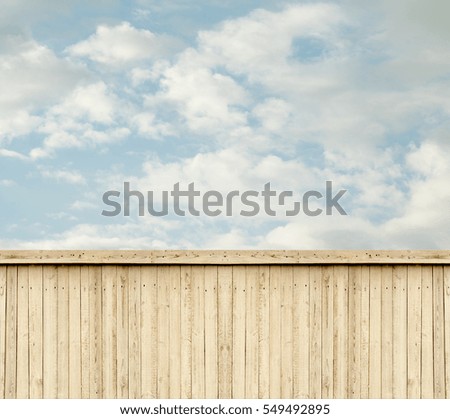 wooden fence sky clouds