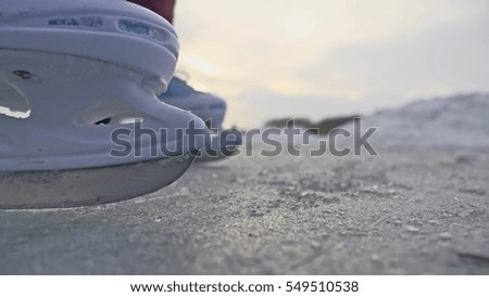 teen girl skating on ice, winter sunset beautiful view, winter holidays