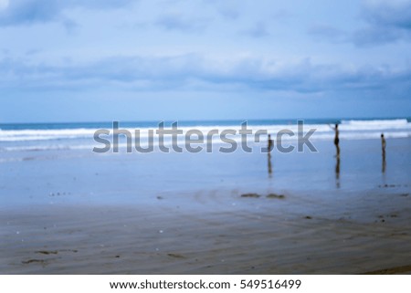 Blur background of people walking on the beach