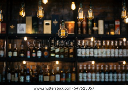 Blurred picture of vintage lamps with liquor bar.