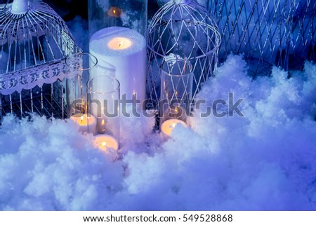 Holiday greeting card and candles in snow