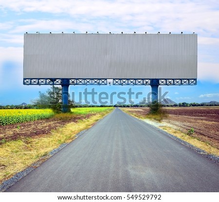 Lane blacklop running through on the farm , with billboard blank